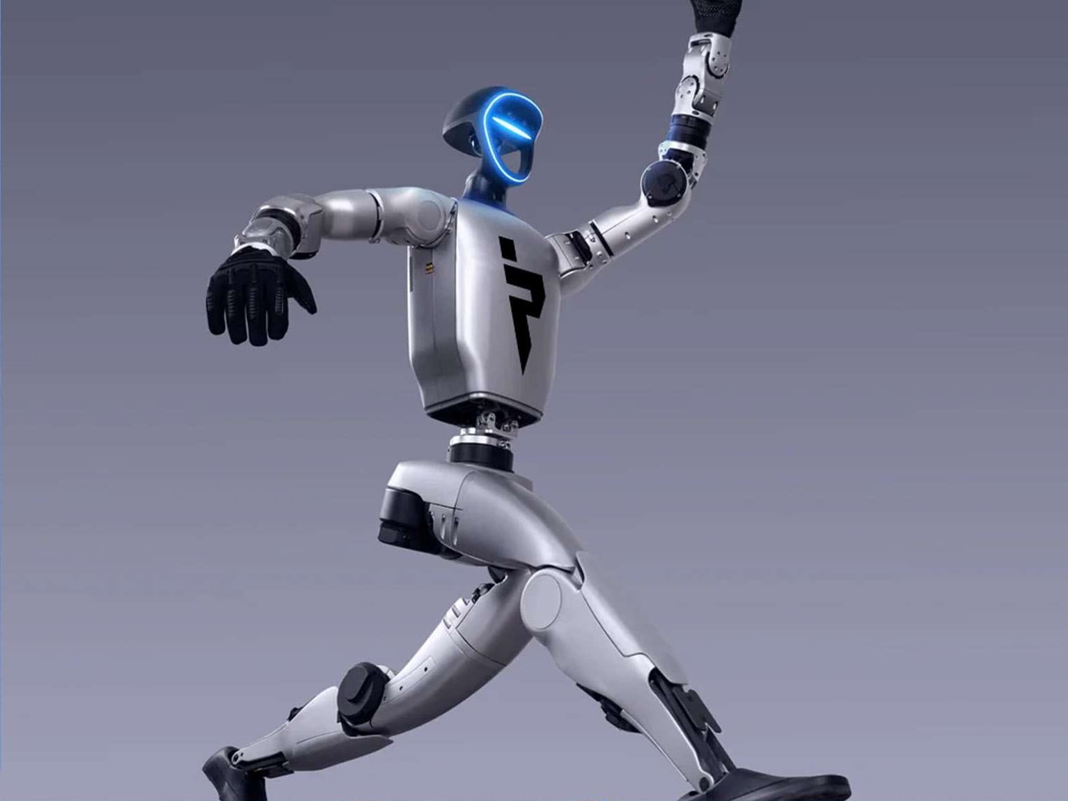 A silver humanoid robot in a fighting stance